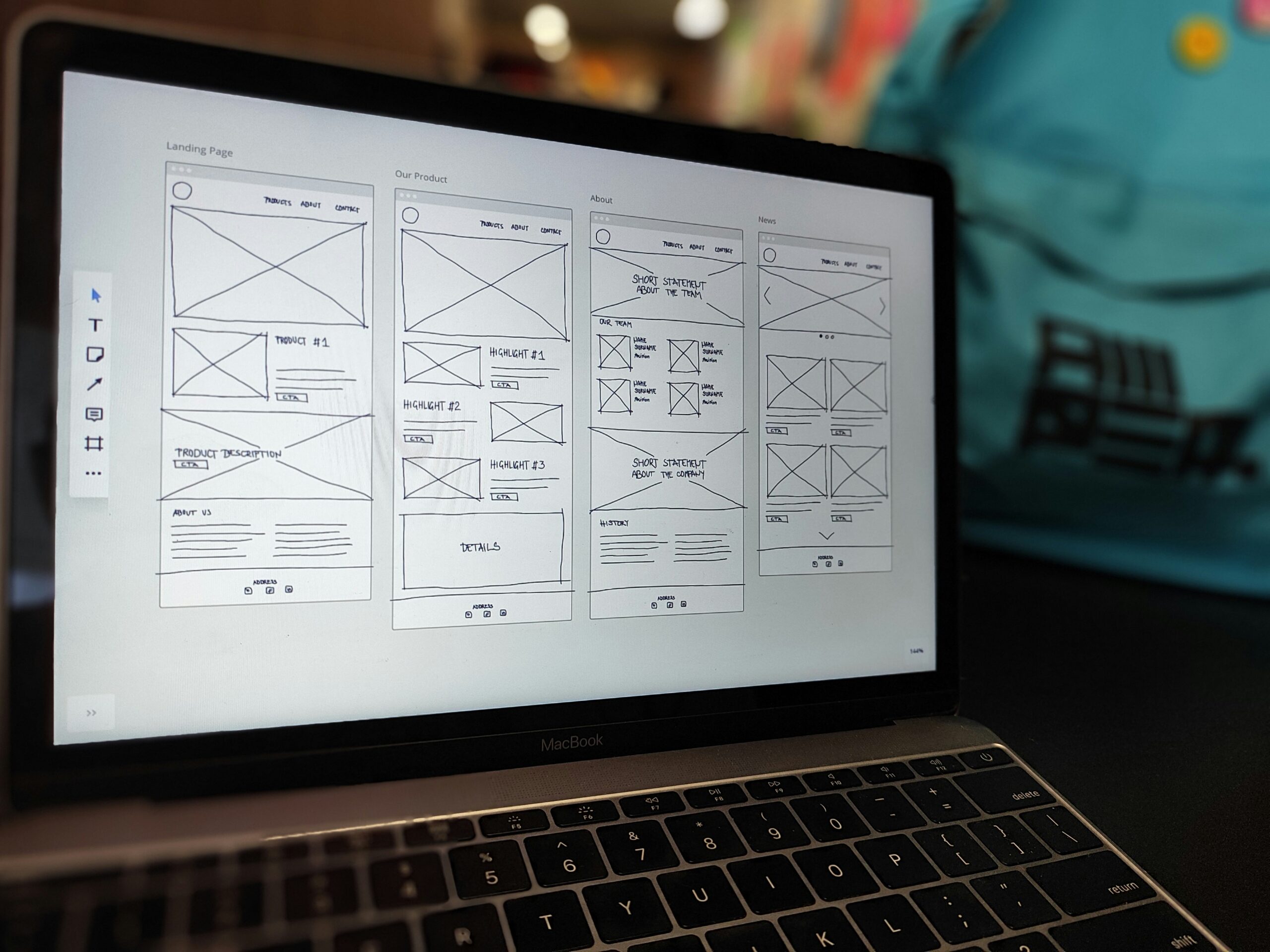 Website wireframe displayed on a laptop during a business web design and development project